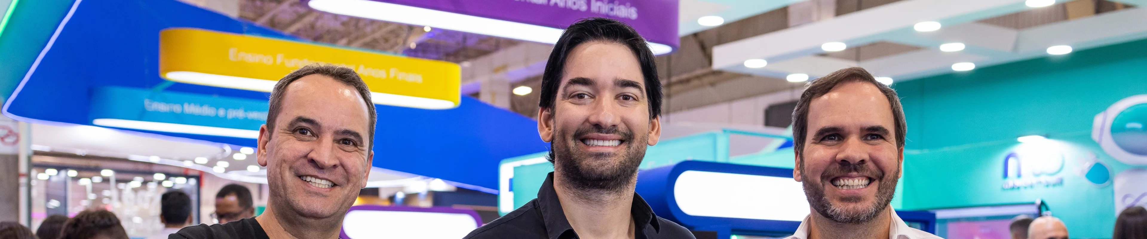 Três diretores do colégio Bernoulli sorrindo